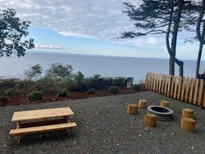 Enjoy the views from picnic table and wood-burning fire pit.