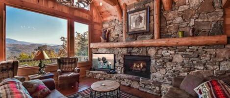 Cozy living area with fireplace, comfy seating and beautiful view!