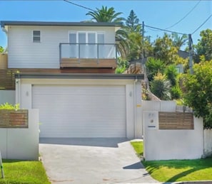 Front of house with double garage.