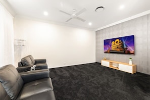 Cinema room with 4-seat sofa
- 65 Inches Smart TV