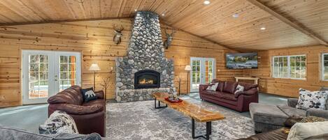 Massive great room with river rock gas fireplace