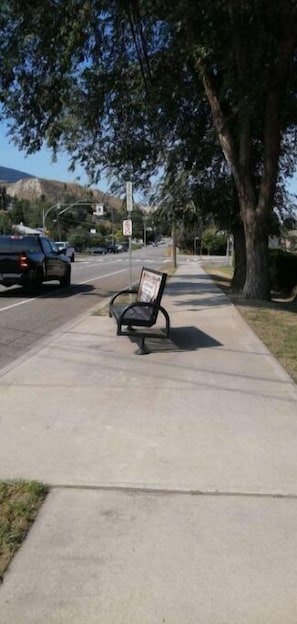 Bus stop across the road in front of pub.