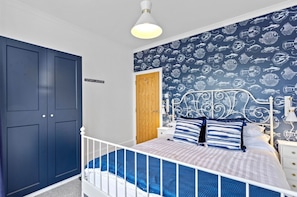 Nautical master bedroom with king size bed