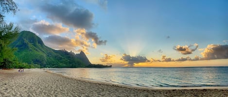 Marvel captivating sunsets at Tunnels beach, a breathtaking spectacle of vibrant hues reflecting upon the pristine waters