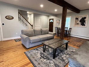 Cloverleaf Farm Den with game table and the main entry door into the home.