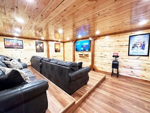 Private theater room with comfortable seating and big-screen entertainment.