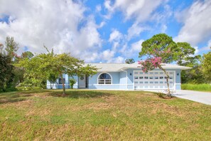 House features a 2 car garage with a remote control for easy access and storage 