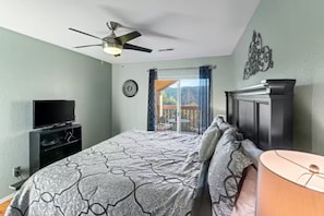 The master bedroom also has a sliding door to the private deck - the perfect spot to savor a morning cup of coffee while taking in the nature all around