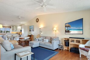 The spacious Living Area is perfect for watching your favorite movies or planning a family game night after a day at the beach.
