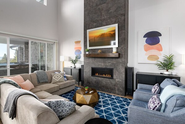 Beautiful & spacious living area with gas fireplace, smart TV, & mountain views