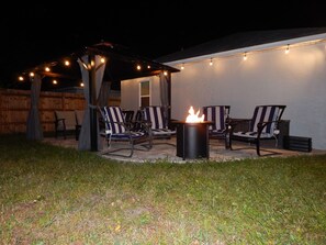 Patio area with fire pit and gazebo