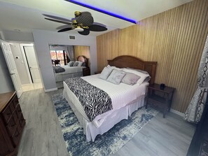 Luxury Vinyl Plank flooring with quiet walk sound proofing and accent rug. 