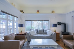 Living room. South and east facing windows. Direct views of the mountains.