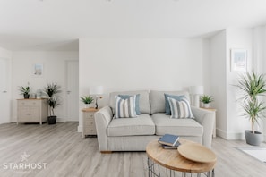 The lounge contains a large sofa that converts into a bed