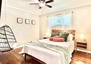 Bedroom 2: Queen bed, 40” TV, hanging chair