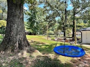 Make the most of outdoor living with a tree swing and ample space to roam.