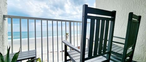 Private balcony with two Polywood rocking chairs.