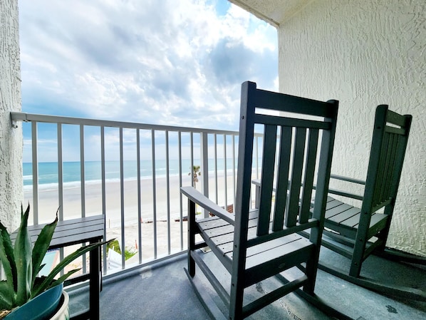 Private balcony with two Polywood rocking chairs.