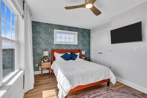 Third floor bedroom with queen bed and 39" TV