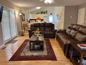 The Federal House Apartment 1 open layout on the 1st floor, living room, kitchen and dining room.