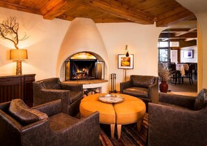 The lobby features seating and a fireplace.