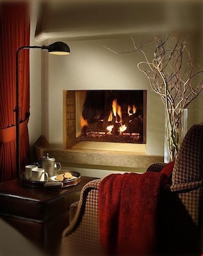 Cozy up in front of the fireplace.