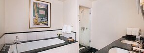 Pamper yourself in the 5-piece marble bathroom, complete with TV and plush bathrobes.