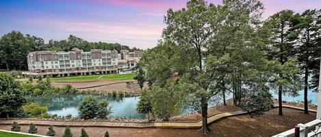 View from your private porch. Lake to the right and swimming pool straight ahead.