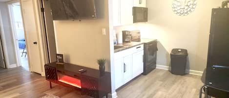 Wide angle shot of Kitchen and living room