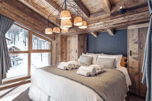 Unwind in the luxurious master suite with a king-sized bed.