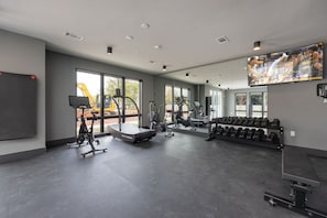 Communal Area: Gym offering a wide range of workout equipment, and a Smart TV.