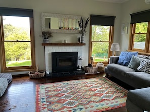 Cosy wood heating and mountain views from the living room