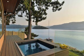 Incredible outdoor living spaces on the oceanside of the main house plus hot tub!