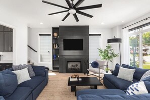 Spacious living room with lots of natural light and comfortable seating for your group. Smart TV with all the streaming apps and an easy-to-use gas fireplace for cozy nights in.