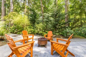 Gather the group by the firepit.