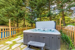 Luxurious hot tub located on the spacious deck.