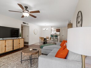 Kick back on the sofa, catch up on your favorite shows on the smart TV, or simply enjoy the company of friends and family in this inviting space.
