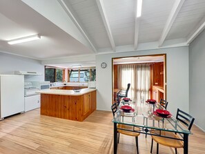 Versatile space integrating kitchen, dining, and office.