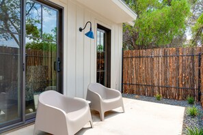 Outdoor seating for two to soak up the sun.