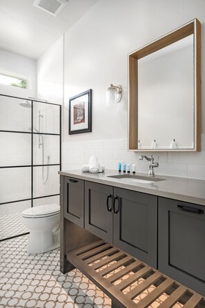 Full bathroom with walk in shower.