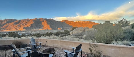 Outdoor fireplace stocked with local piñon wood