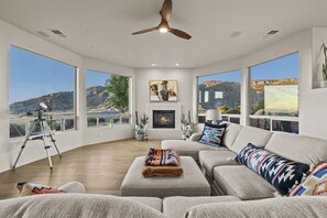 Main living area with fireplace and panoramic mountain views