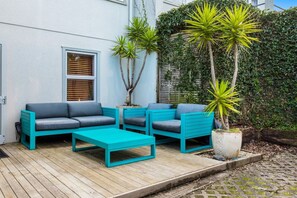 Unwind on the deck's trendy outdoor furniture.