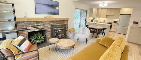 Living room space with Frame TV and gas fireplace