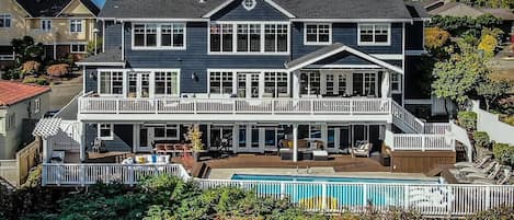 Expansive 6000 square foot property with swimming pool, hot tub, 2 decks, 3 outdoor fire pits. Outdoor kitchen, 1 outdoor dining table that seats 10-12 on top deck  and one on lower deck that seats 12 plus. All covered with gas heat.