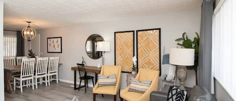 Living room opens up to dining room and kitchen