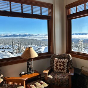 Relax by the fireplace with uninterrupted mountain views