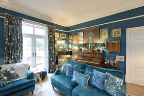 The Peacock Drawing Room with real log fire. Wood provided free. 65" Smart TV.
