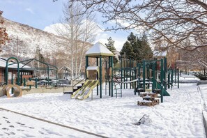 A beautiful park is located across the street from the home and features a large playground, a picnic area, sand volleyball courts, and an outdoor basketball court.