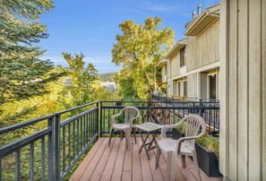 Step out to the balcony where you will find two chairs to sit and enjoy the views over the trees and Wasatch mountains.